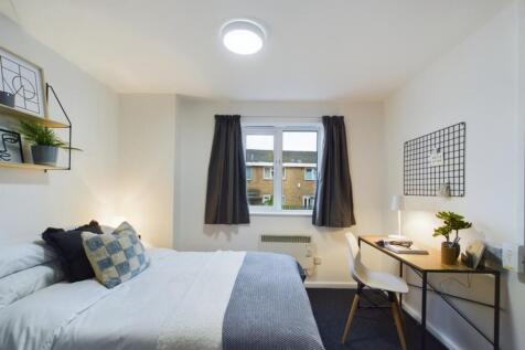 A bright and inviting double bedroom featuring ...