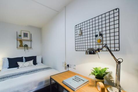A bright and inviting double bedroom featuring ...