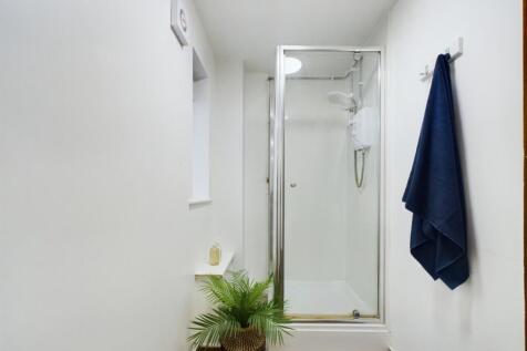 A modern and stylish bathroom featuring a clean...