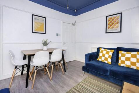 A bright and inviting large modern living room,...