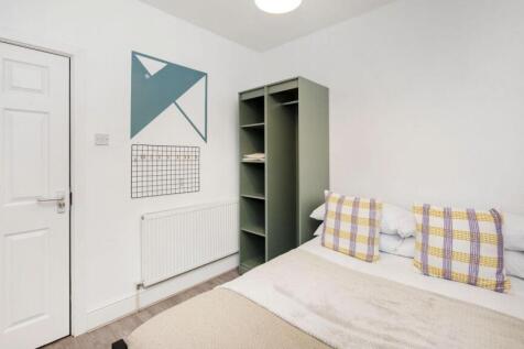 A cozy and well-decorated double bedroom, perfe...
