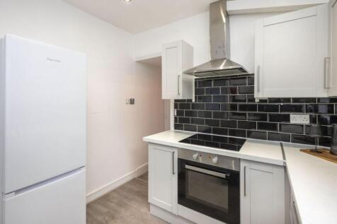 A modern and clean kitchenette featuring sleek ...