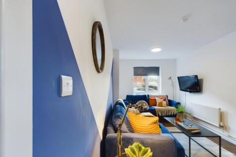 A bright and spacious modern living room, perfe...