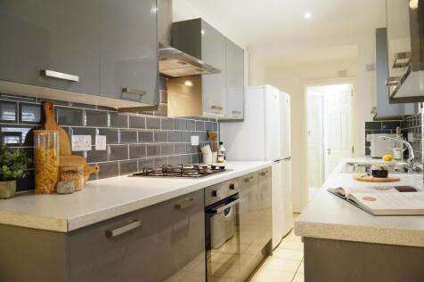 Bright and modern kitchen with ample countertop...