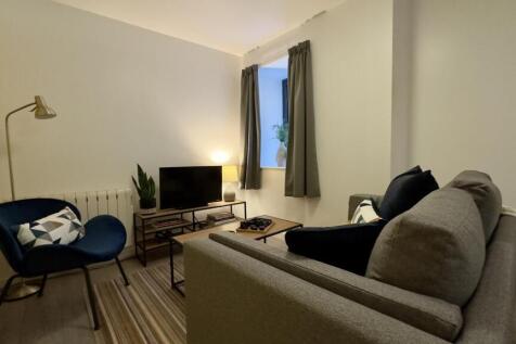 A cozy and inviting living room with stylish de...