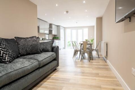 Contemporary open-plan living and dining area w...