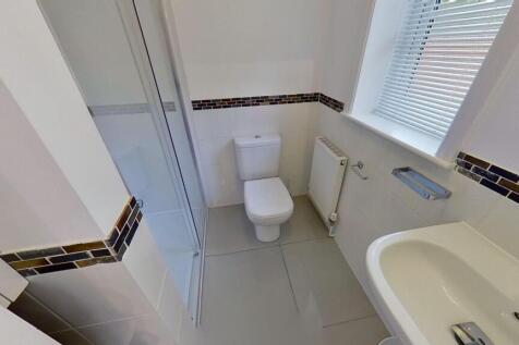 Bright, modern bathroom with white sanitaryware...