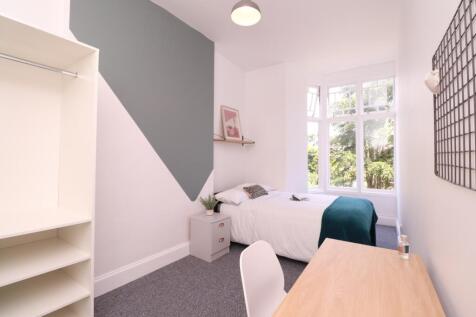 A bright and inviting double bedroom featuring ...