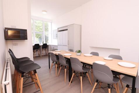 A bright and spacious kitchen area with modern ...