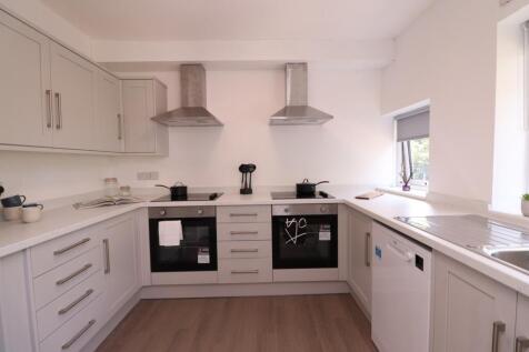A modern and tidy kitchen with ample counter sp...