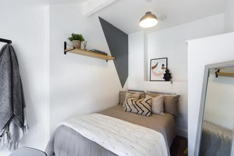 A stylish and well-lit double bedroom, perfect ...