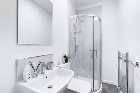 A modern and clean bathroom featuring a stylish...