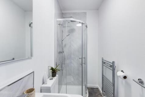 A modern and clean bathroom featuring a stylish...