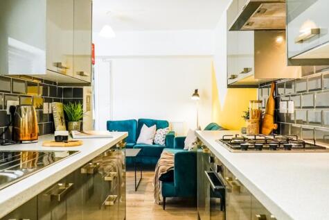 A modern and inviting kitchen area with stylish...