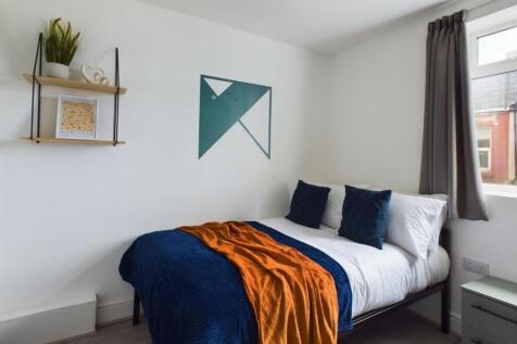 A stylish and inviting double bedroom featuring...