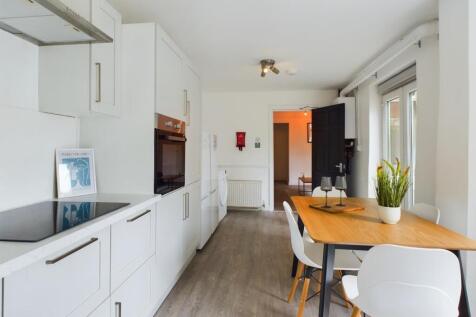 A modern and tidy kitchenette featuring stylish...