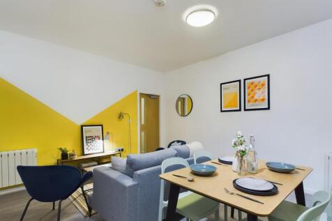 A bright and inviting large modern living room ...