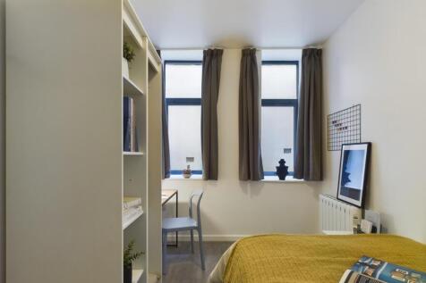 A bright and inviting double bedroom featuring ...