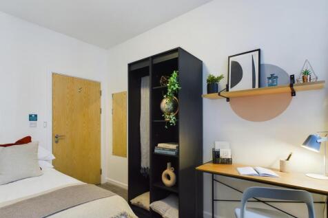 A stylish and inviting double bedroom with mode...