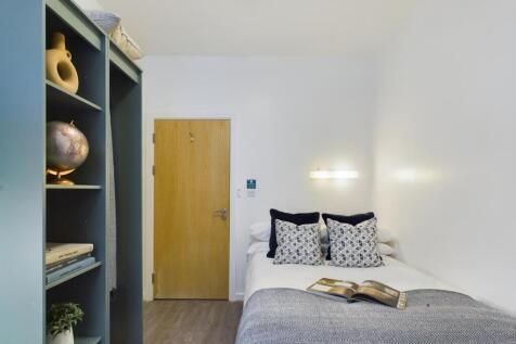 A bright and inviting double bedroom featuring ...