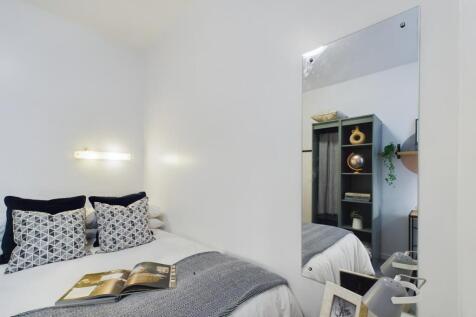 A bright and inviting double bedroom featuring ...