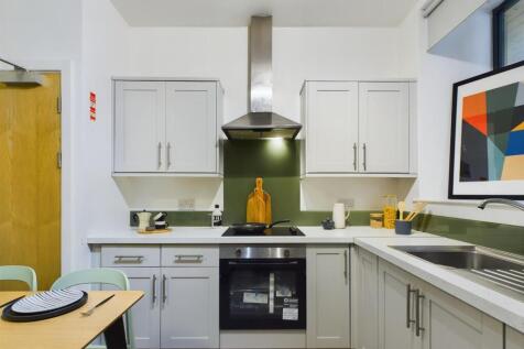 A modern and well-maintained kitchenette featur...