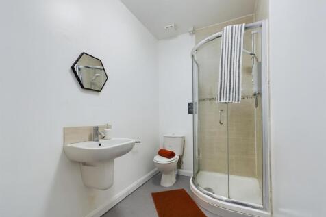 A clean and modern bathroom featuring a stylish...