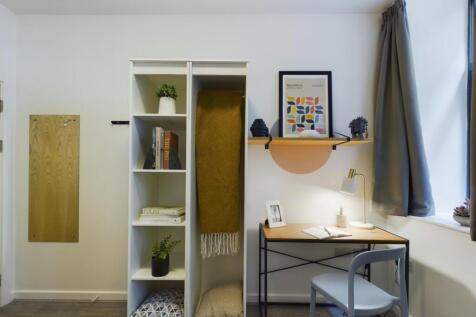 A stylish and inviting double bedroom with ampl...