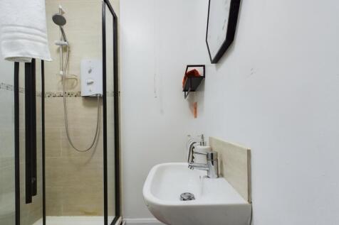 A modern and well-maintained bathroom featuring...