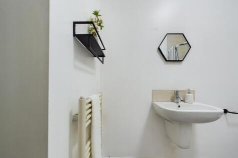 A modern and clean bathroom featuring stylish d...
