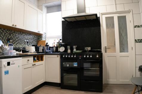 A cozy and functional kitchenette with modern a...