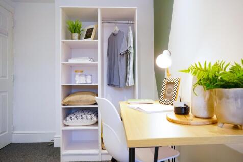 A stylish and organized small storage area with...