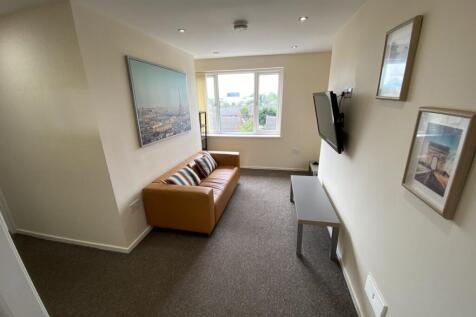 A bright and inviting living room with modern d...