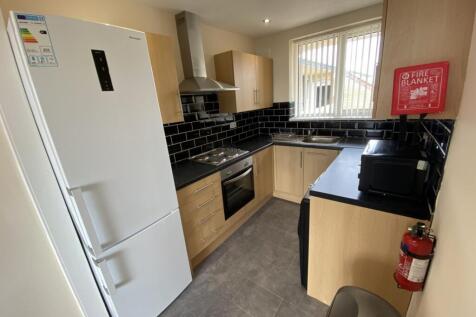 A modern and well-equipped kitchenette with amp...