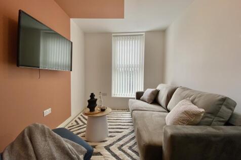 A cozy and inviting living room with modern dec...