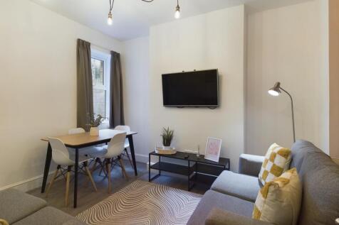 A bright and stylish large modern living room, ...