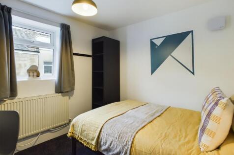 A bright and inviting double bedroom featuring ...