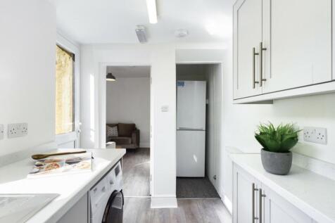 A bright and modern kitchenette featuring sleek...