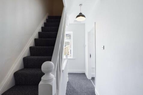 A clean and inviting hallway with stylish decor...