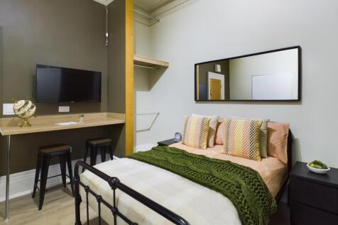 A stylish and inviting double bedroom featuring...