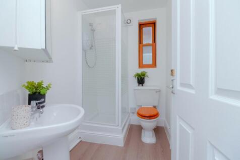 A bright and modern bathroom featuring a sleek ...