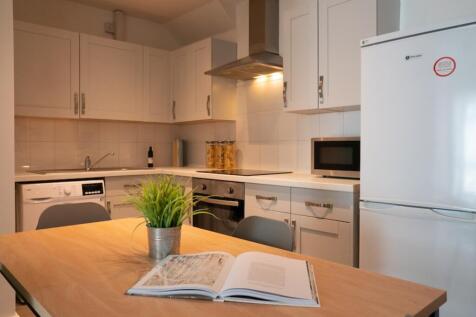 A bright and modern kitchenette featuring sleek...