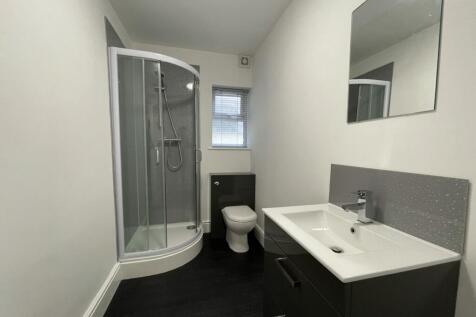 A modern and stylish bathroom featuring a sleek...