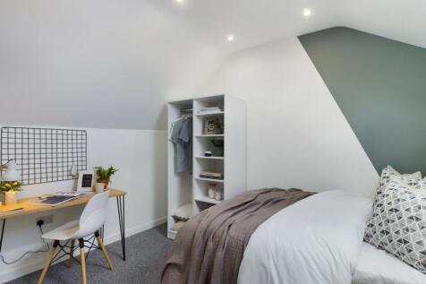 A stylish and inviting double bedroom with a co...