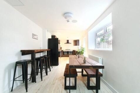 A bright and spacious kitchen area with modern ...