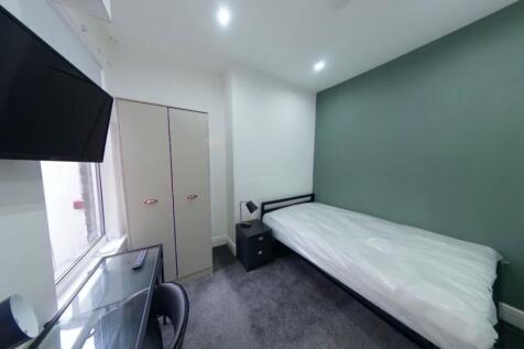 A bright and modern double bedroom featuring a ...