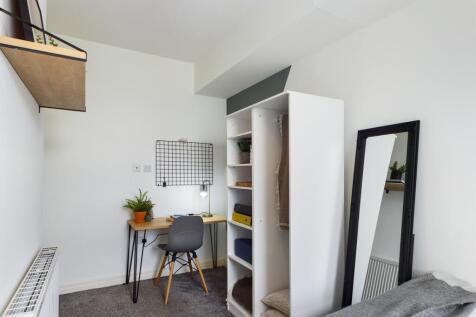 A cozy and inviting double bedroom featuring a ...