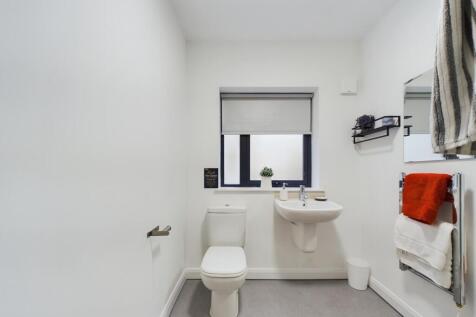 A modern and clean bathroom featuring a stylish...