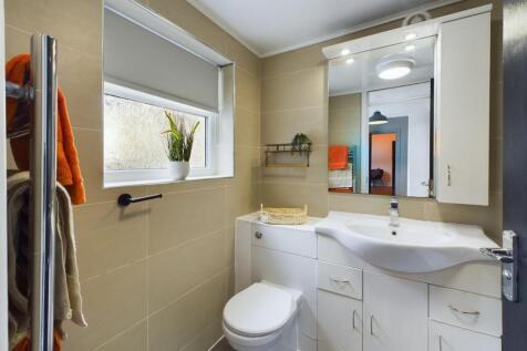 A modern and well-maintained bathroom featuring...