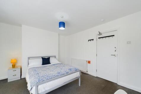 Bright and tidy double bedroom featuring a larg...